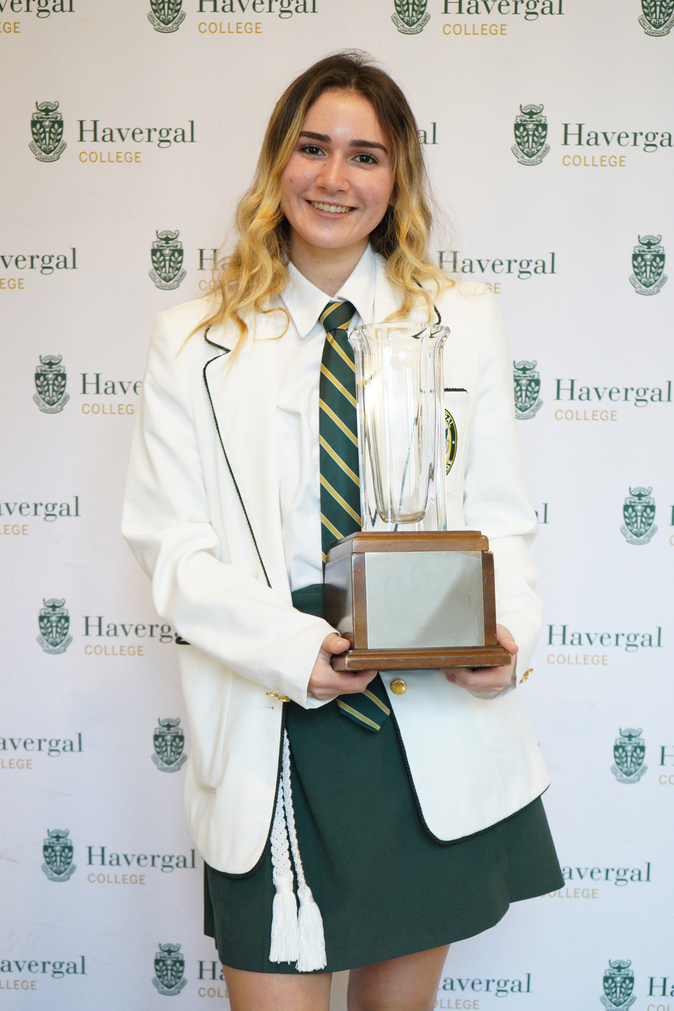 Student with trophy.