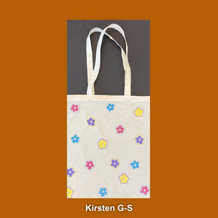 Flowers embroidered on a white canvas bag.