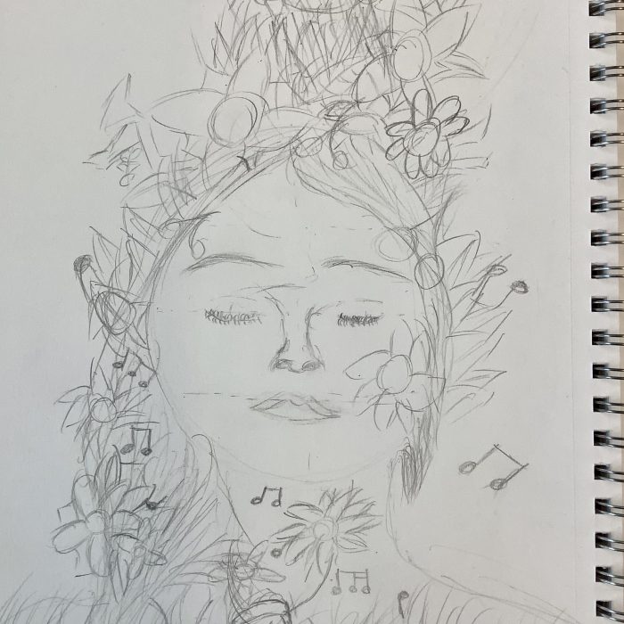 Sketch of a face with flowers around it.