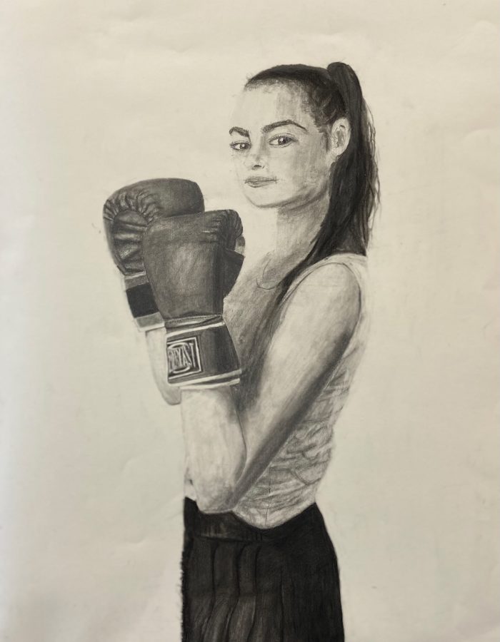 Sketch of student wearing punching gloves.