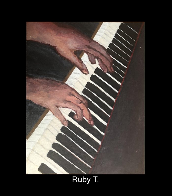 Hands playing on the piano