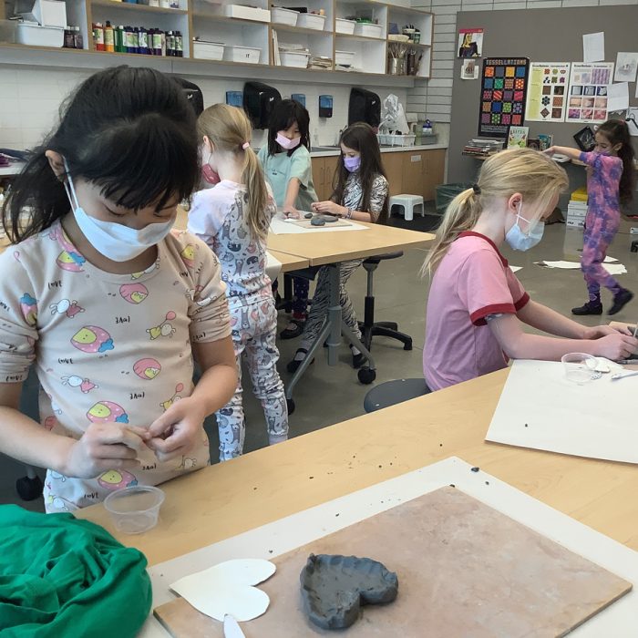 Students making a clay hearts.