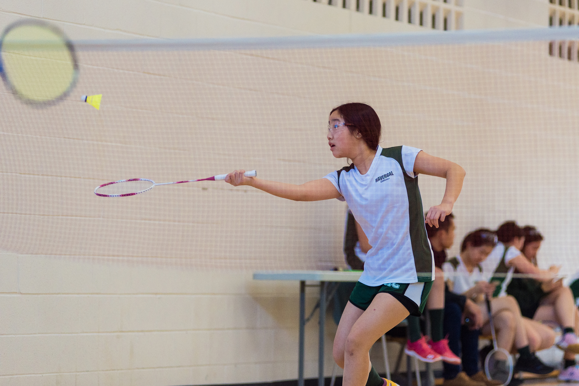 Student playing badminton.