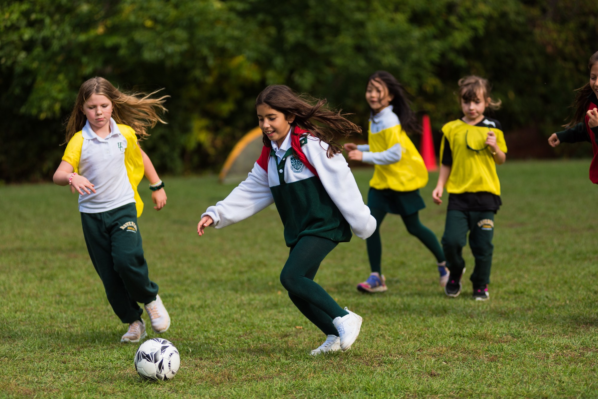 Junior School students playing soccer.