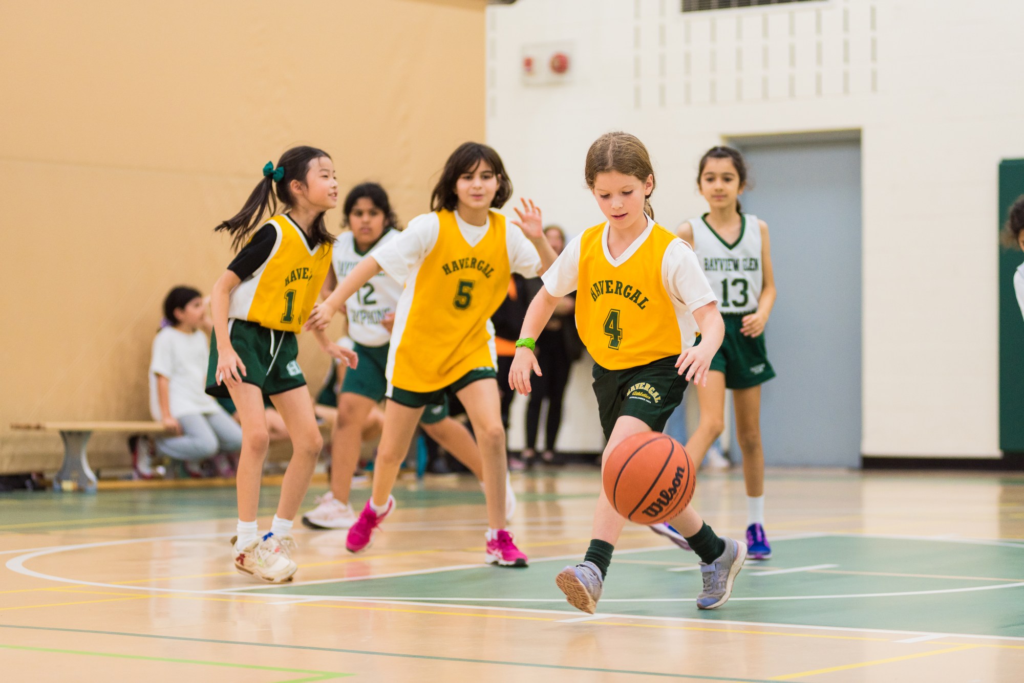Junior School students playing basketball.
