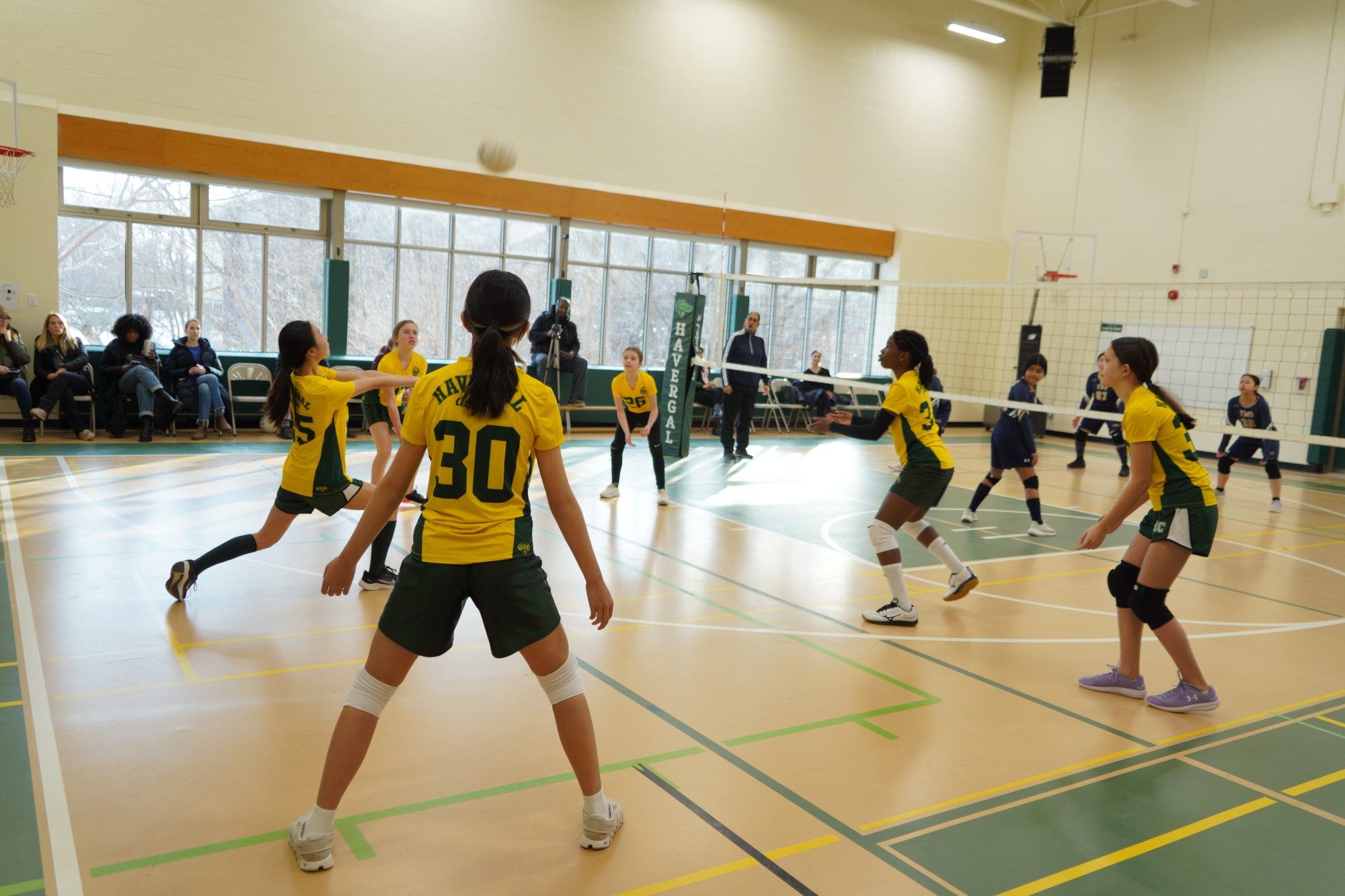 Junior School students playing volleyball.
