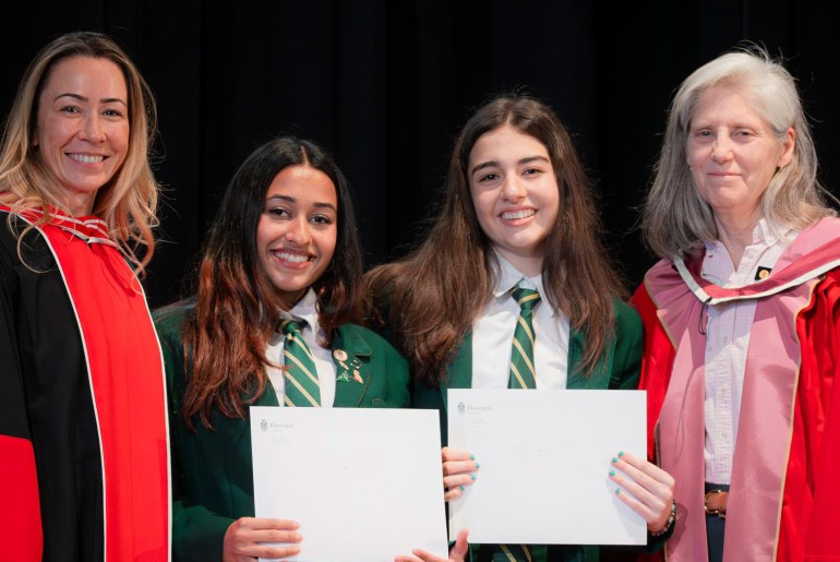 Principal and Vice Principal with students on Awards Day.